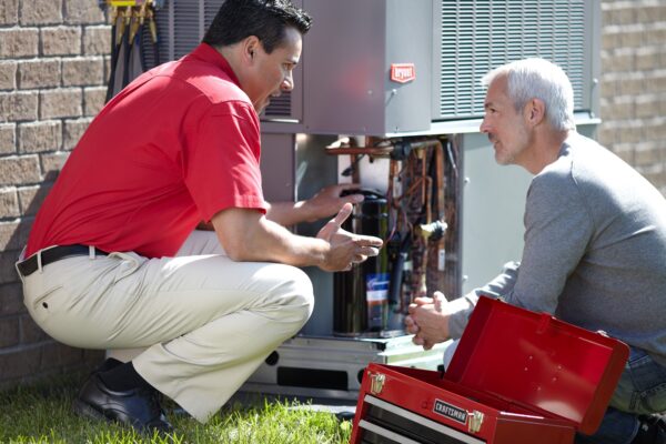 HVAC Technician Explaining AC Maintenance to Customer in Las Vegas, NV